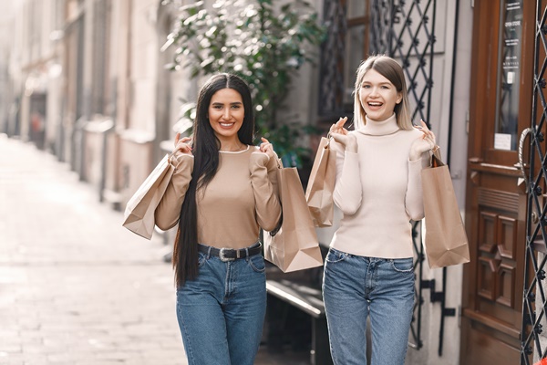happy girls with shopping bags
