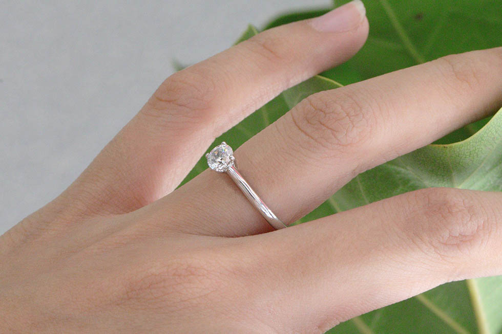 women diamond ring on ring finger