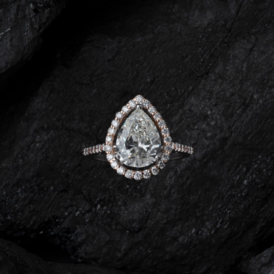 diamond ring on dark background